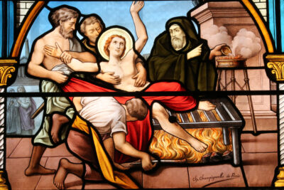 Stained glass window. The Martyrdom of St. Lawrence.
